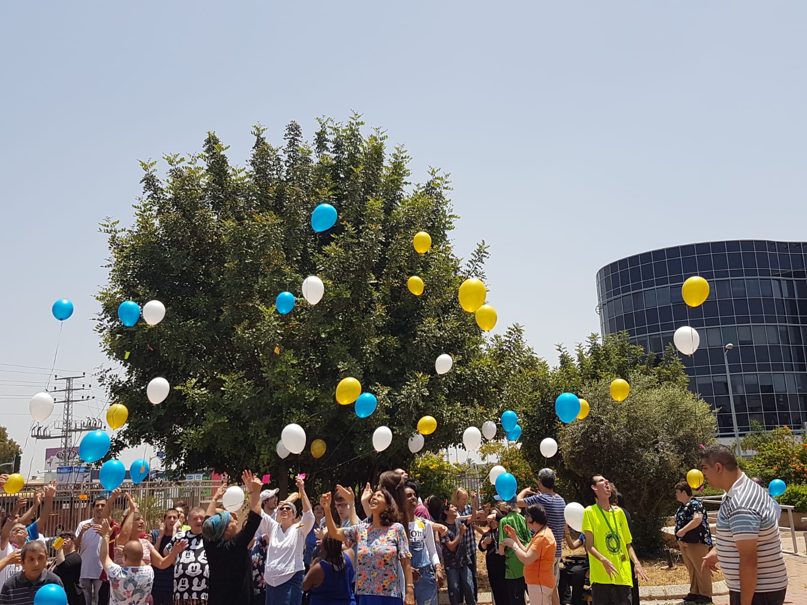 Participants of SHEKEL's Petach Tikva day center celebrate Jerusalem day, flying their prayers straight to Heaven!